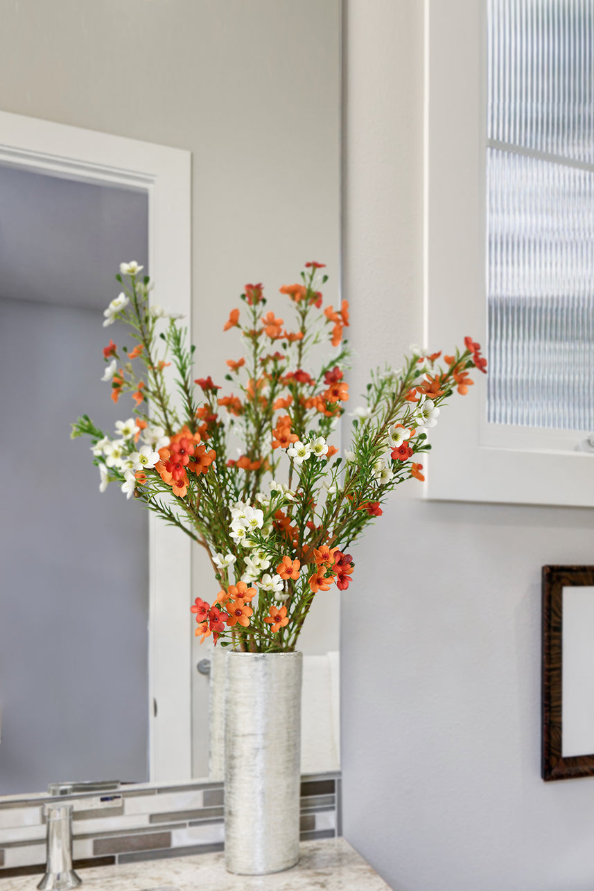 The bright orange artificial wax flower seems to need white to neutralize, it is suitable for the coffee table or shelf.
