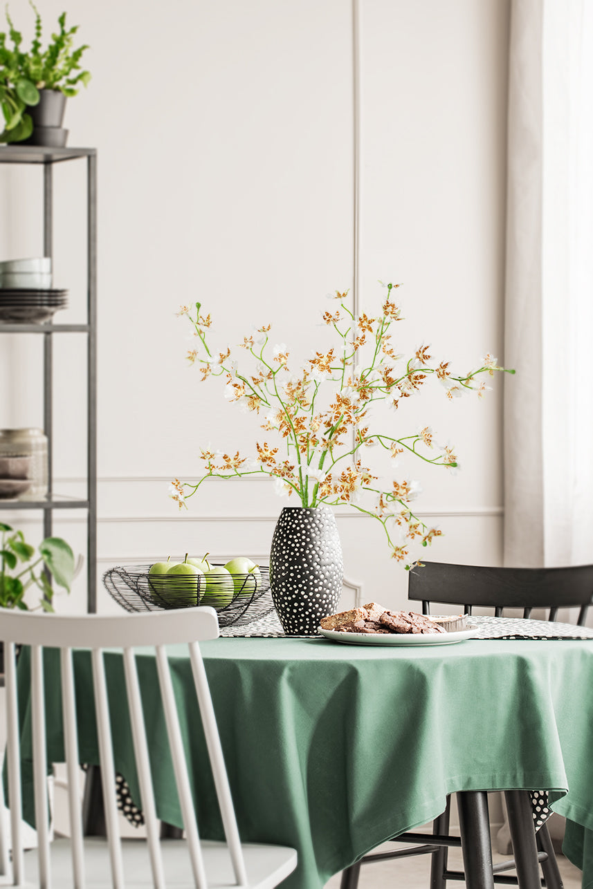 The Cream White Artificial Oncidium captures its essence, bringing a touch of opulence to any space.
