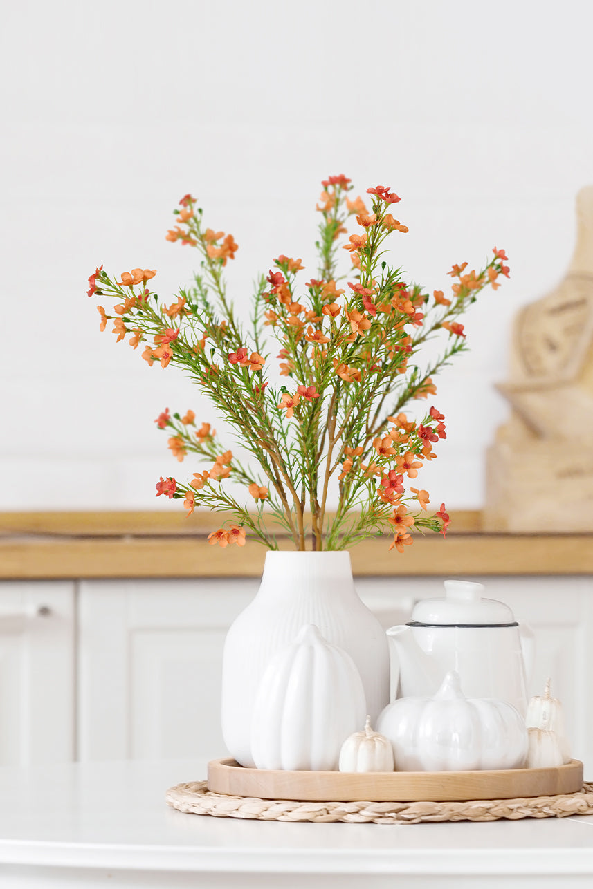 Indulge in the joy of everlasting beauty with our artificial wax flower in orange. Let its vibrant color and delicate allure breathe life into your home or office space.