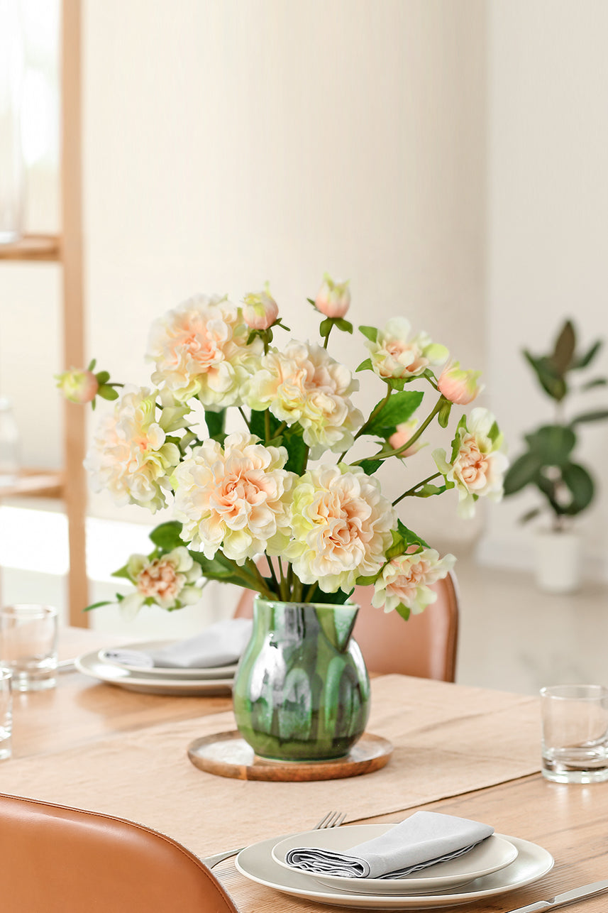 The flower shape of the artificial paeonia is round and gives people a comfortable feeling. You can try to place it on the dining table.