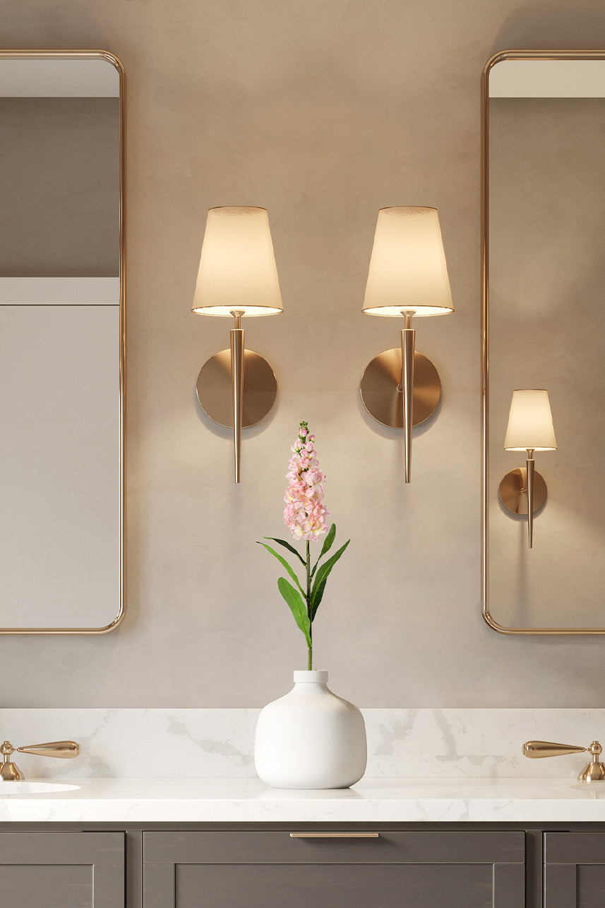 Mauve Pink artificial matthiola incana are placed in a white vase with warm lighting to bring a more comfortable atmosphere to the bathroom.