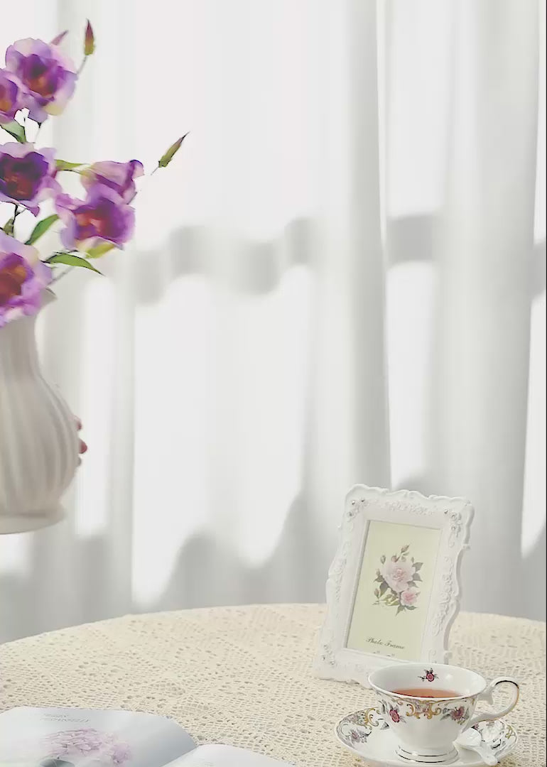 The purple artificial lisianthus floral arrangement against a white or retro background seamlessly blends modern refinement with retro charm.