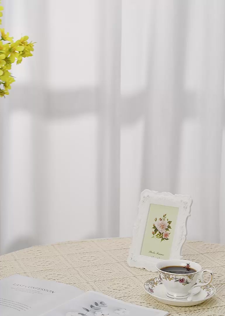 Bask in the warm glow of sunny delight with a faux yellow cosmos flower floral arrangement set against a white or retro-inspired background.