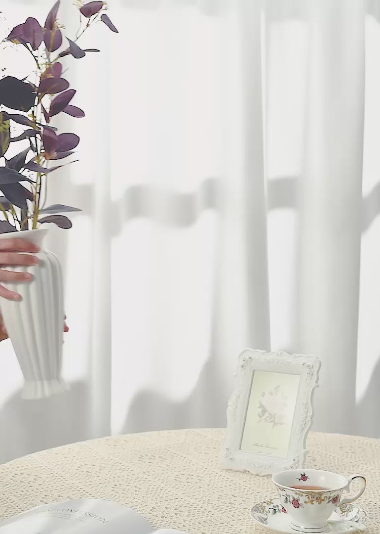 The burgundy Parisian eucalyptus leaves floral arrangement against a white or retro background exudes timeless elegance and vintage allure.