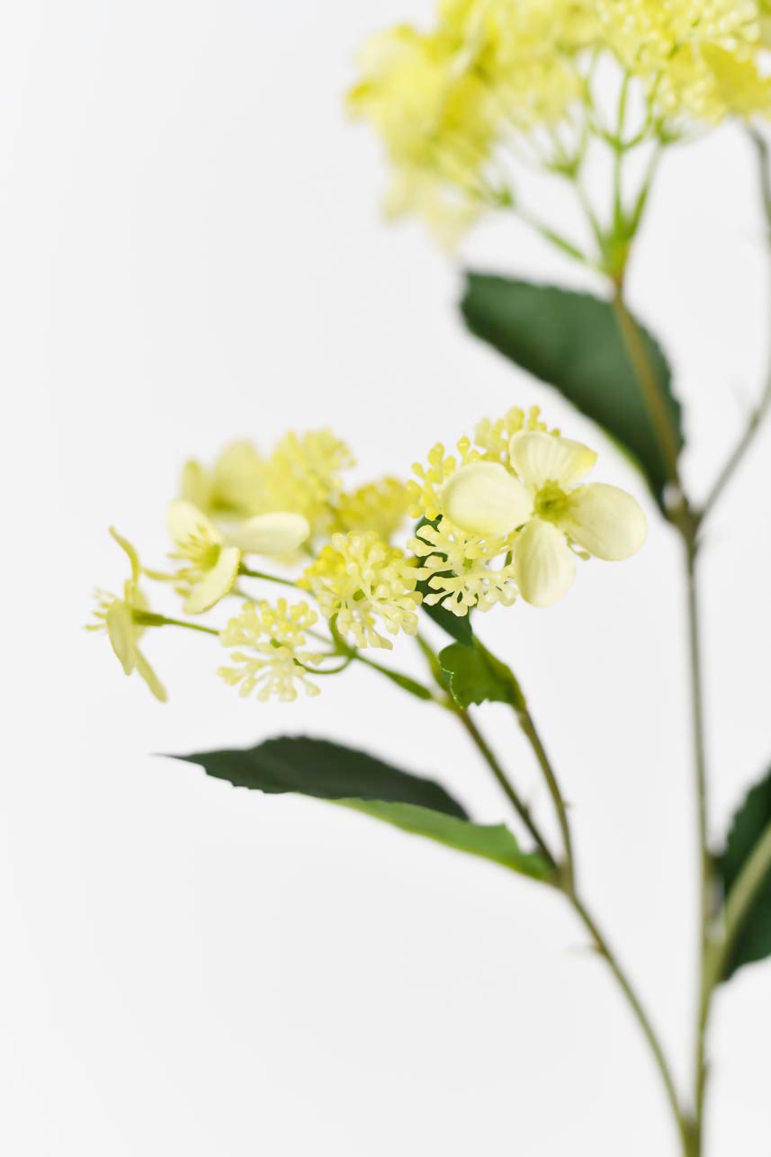 Life-like yellow Hydrangea Hortensia silk flowers, 27-inch artificial with bright green leaves.