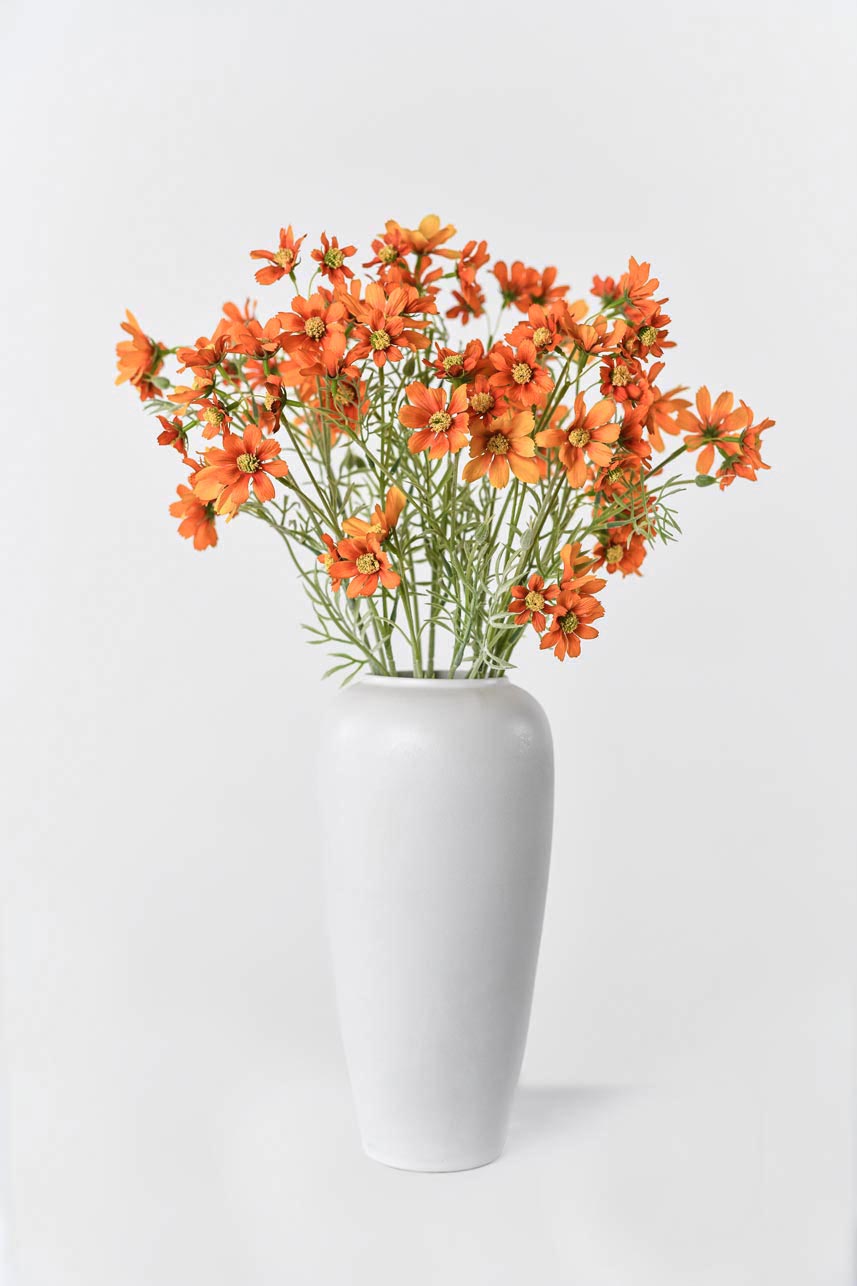 A beautiful orange artificial cosmos flower on a long stem, standing at 31 inches in height.