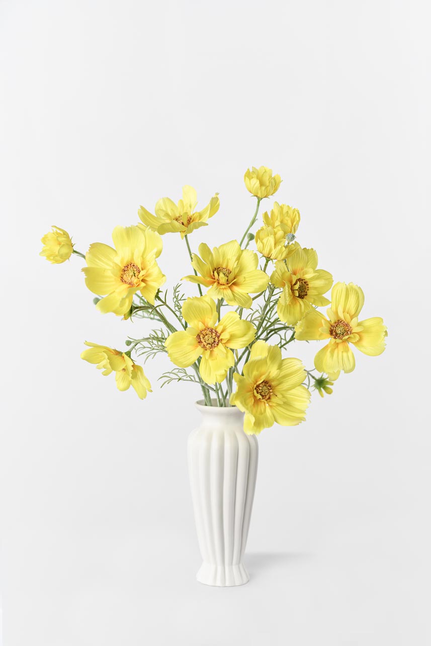 Artificial yellow Cosmos sulphureus arrangement, adding natural charm to any space