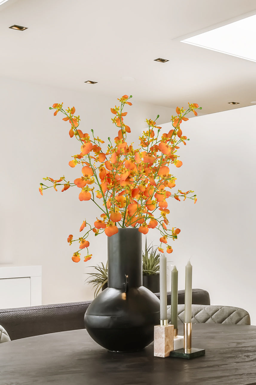 The orange artificial dancing orchid is so dazzling that one cannot ignore its presence, and it suits the style of modern home decoration.