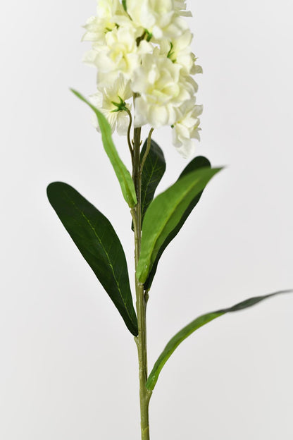 An artificial matthiola incana flower in cream white color with faux stems