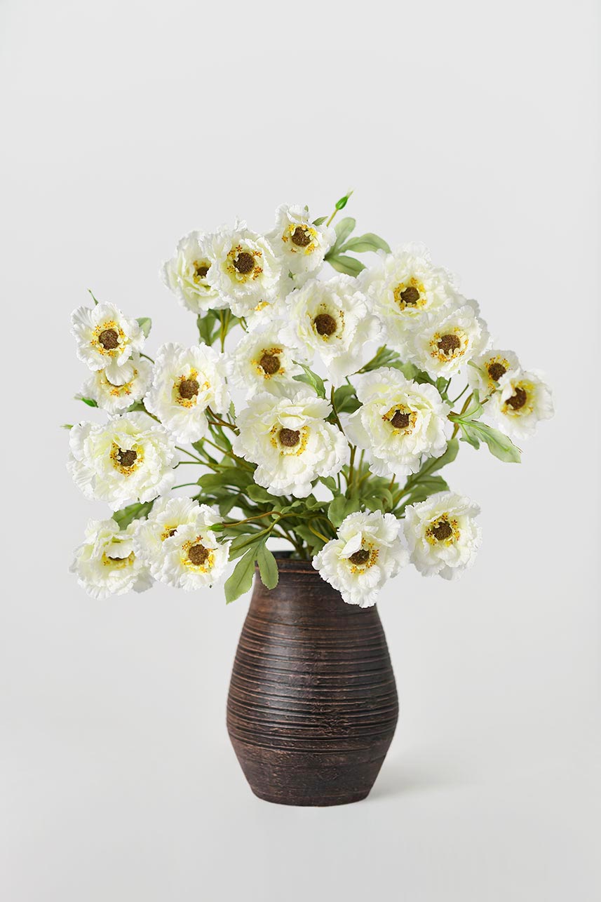 The budding to full bloom artificial cream-white lotus crane peony fake flowers are complete with a brown vase perfect as a centerpiece.