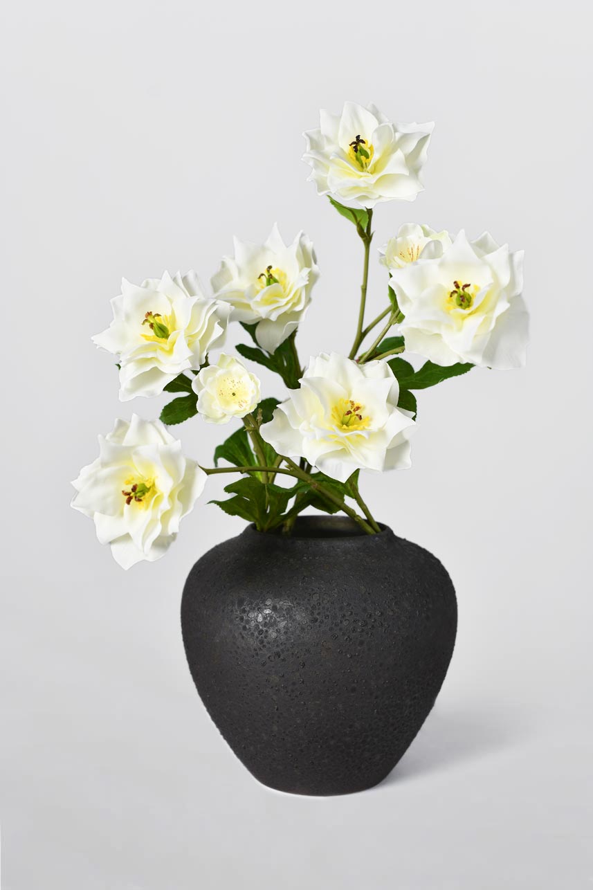 Artificial clematis is a great material for floral arrangements and can be designed into special shapes and placed in the center of a home scene.
