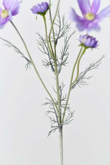 The leaves and stems of the light purple Faux Cosmos flowers, adding a natural touch to any decor.