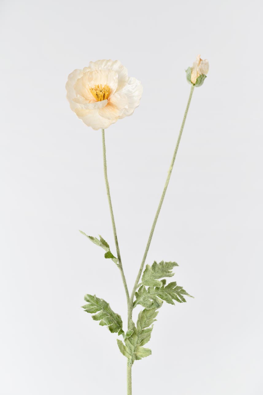 Beautiful faux Iceland poppy flowers in peach color with a long faux stem, perfect for decorating any space.