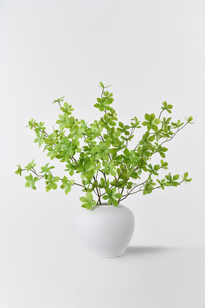 Realistic light green enkianthus perulatus in a vase, providing a natural touch to your space