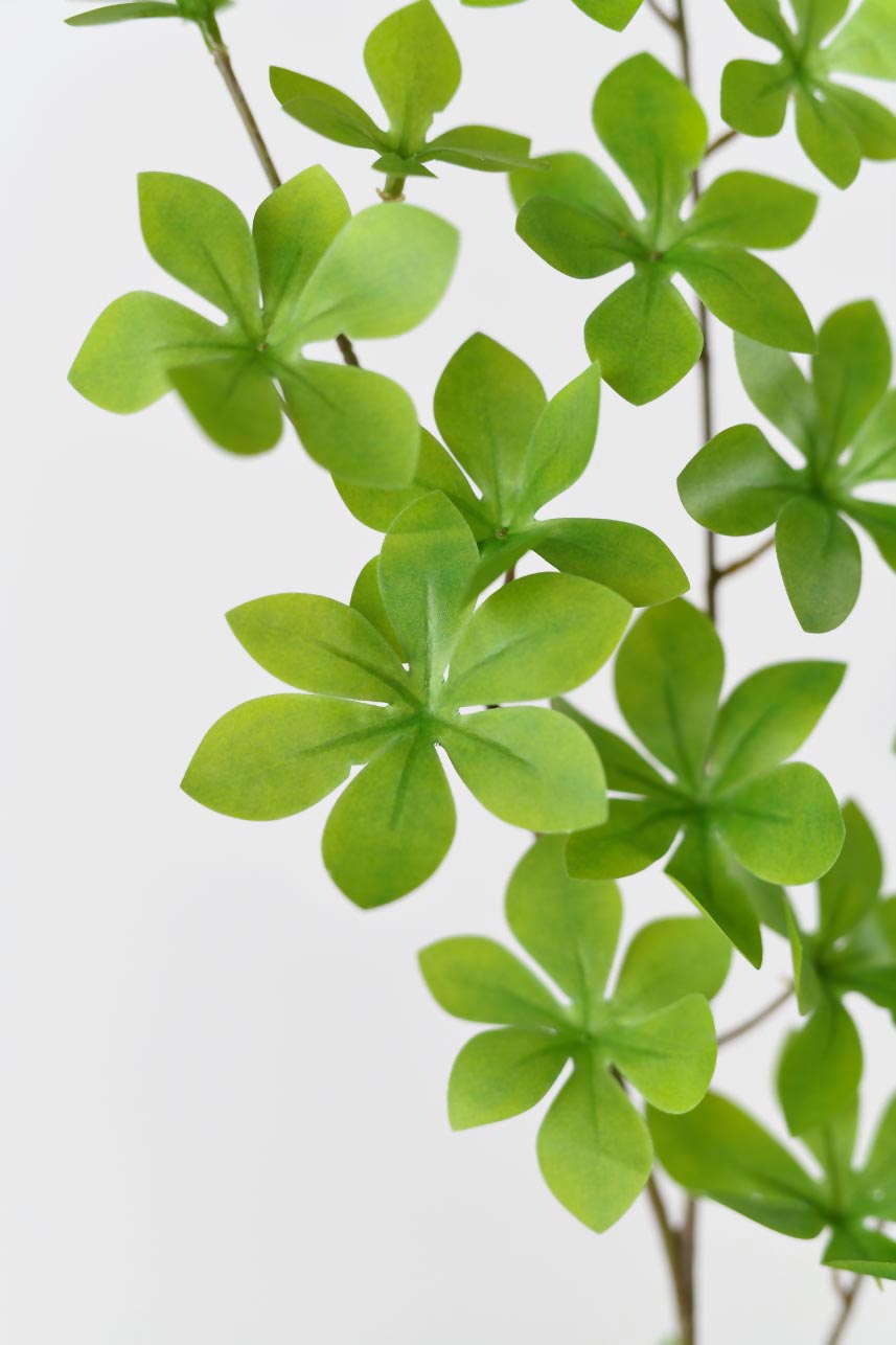 Light green faux enkianthus perulatus arranged in a silk blooming arrangement, perfect for any decor