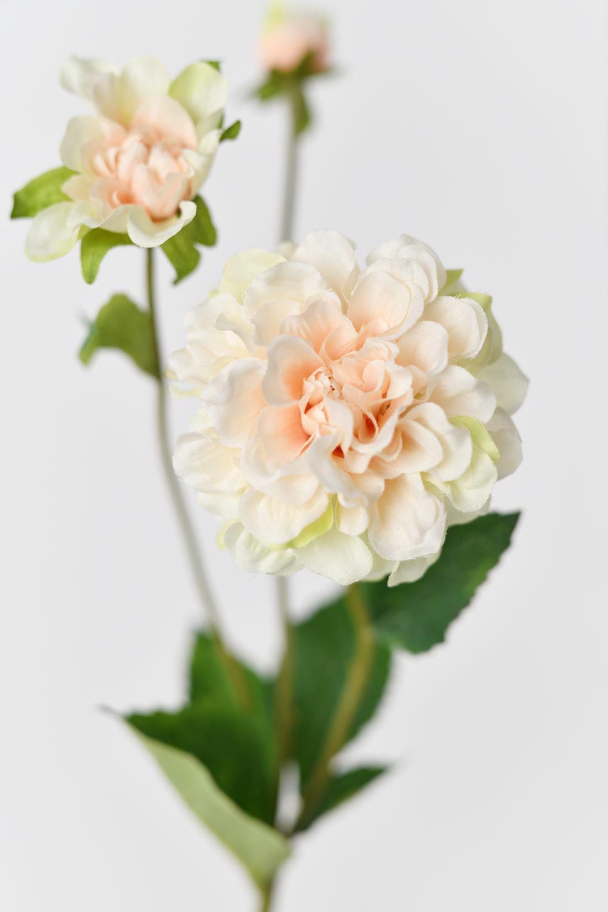 Faux blush peach peony flowers for decorating or crafting purposes, featuring a realistic appearance and soft texture.