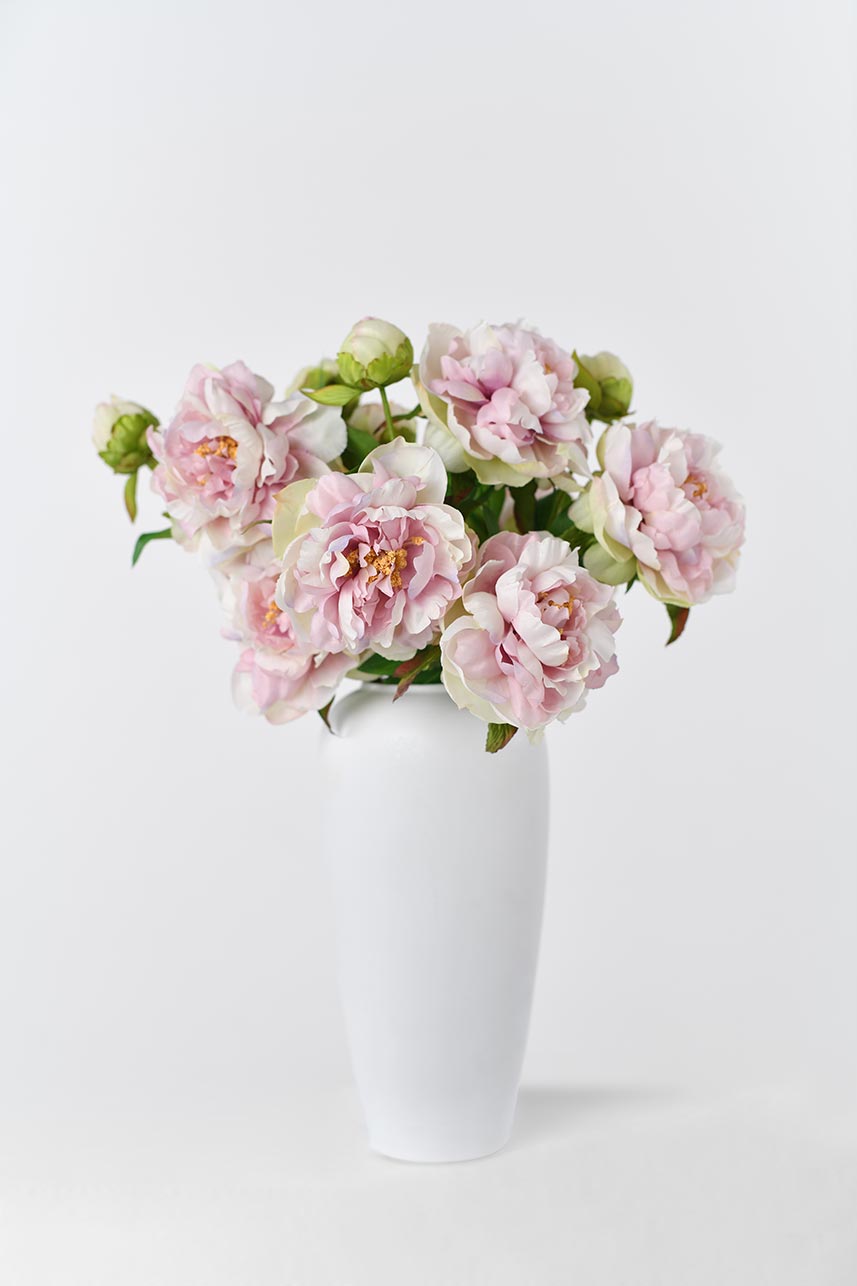 A silk Phoenix peony in pastel lavender, pink and cream colors with realistic petals and long stems, ideal for home decoration.