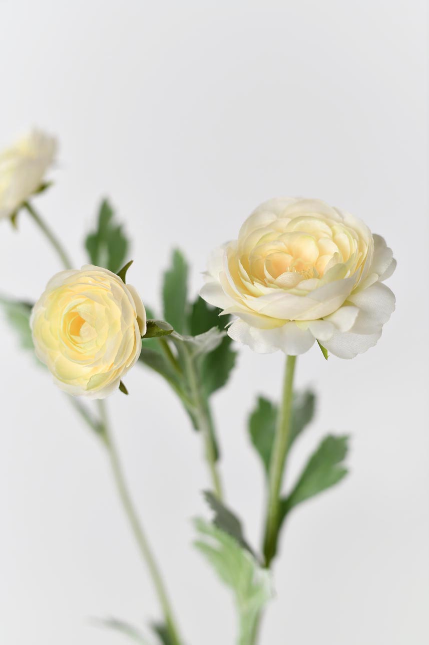 Faux ranunculus flower petals in yellow peach color, perfect for adding texture and color to any floral arrangement.