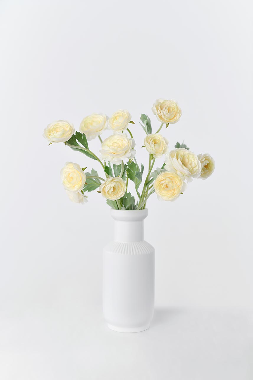 Beautiful faux ranunculus flowers in yellow peach color with faux stems, perfect for creating stunning vase centerpieces or floral arrangements.
