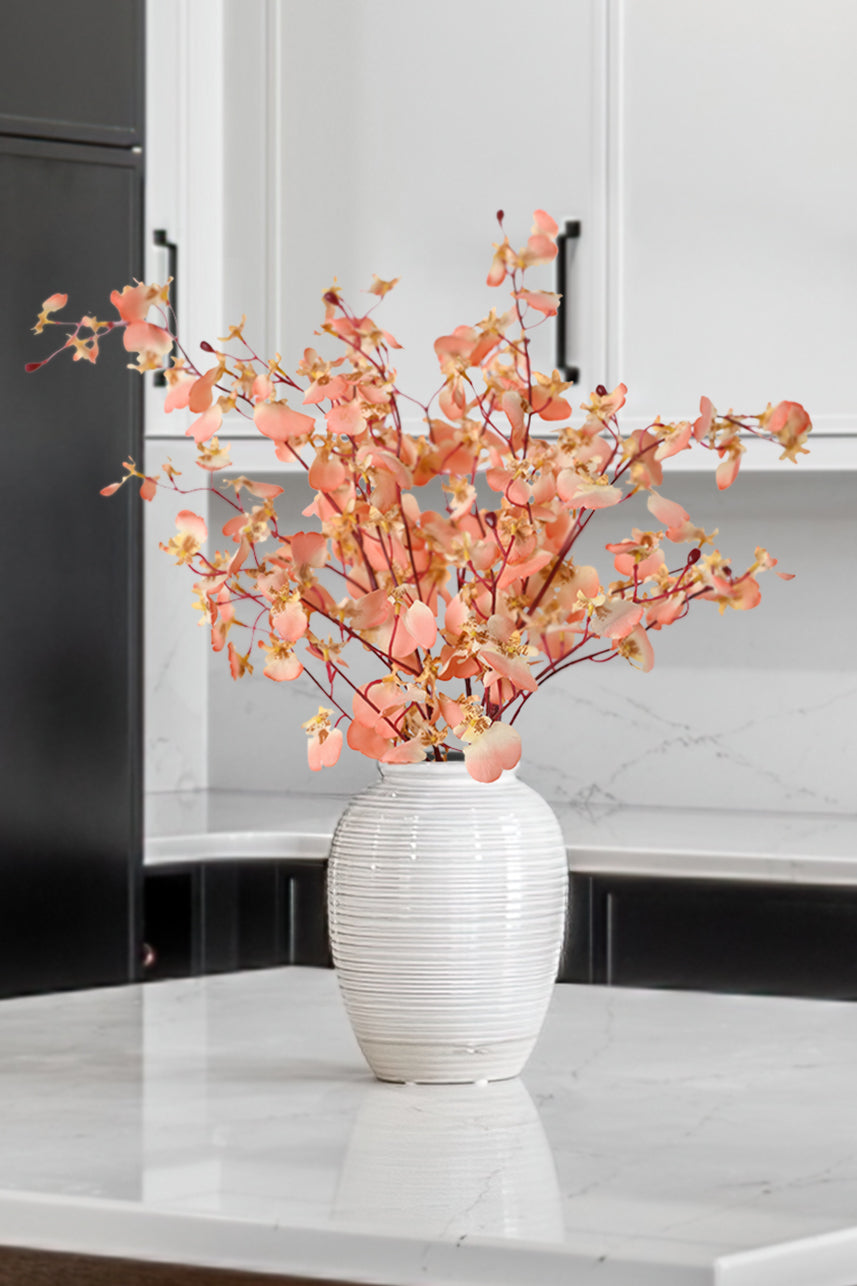 Artificial dancing orchid flowers in coral pink are a testament to the fusion of artistry and technology, bringing the elegance of nature into our lives.