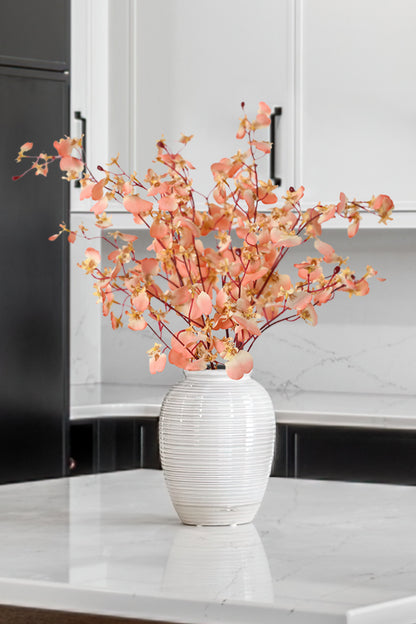 Artificial dancing orchid flowers in coral pink are a testament to the fusion of artistry and technology, bringing the elegance of nature into our lives.