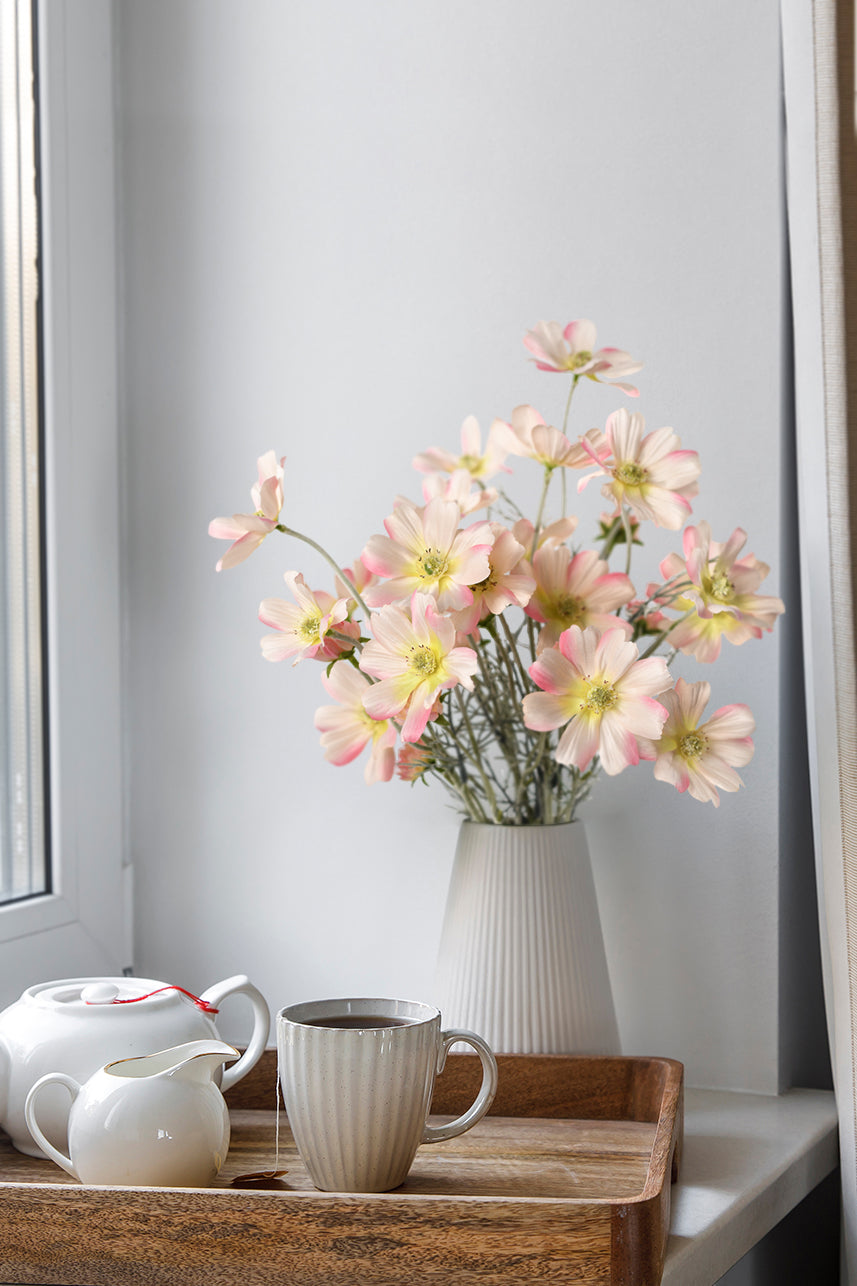Blush pink artificial Cosmos flower graces the kitchen decor, bringing a delicate and charming touch to the heart of the home.