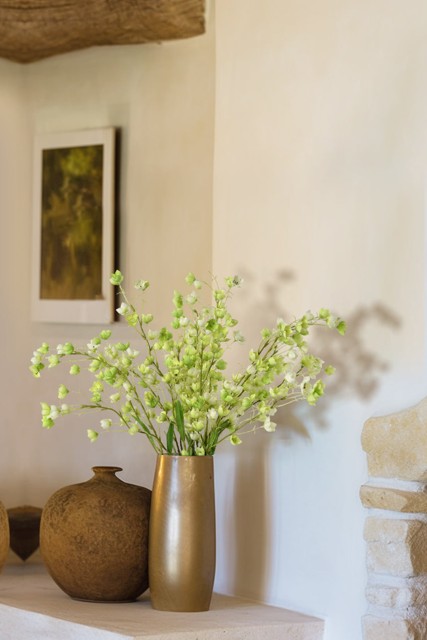 Transform your table into a captivating oasis of beauty with our exquisite faux green Enkianthus flowers. These lifelike blooms effortlessly bring the allure of nature indoors.