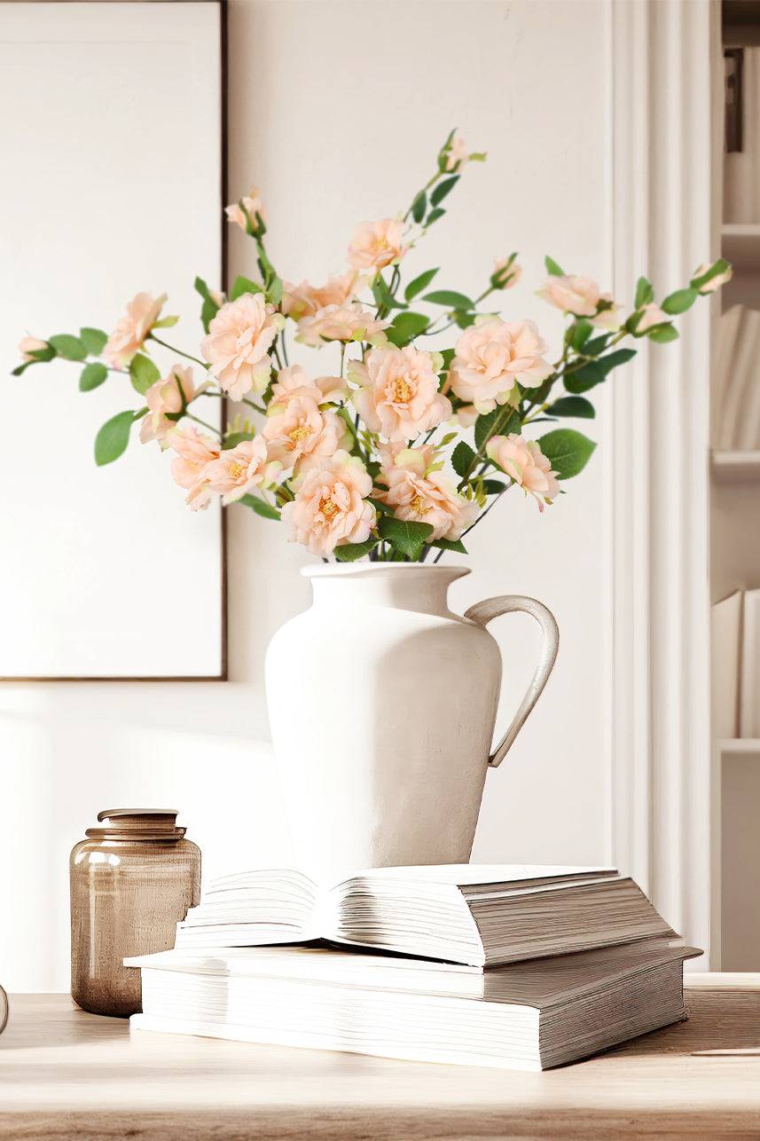 Add a touch of elegance to your home table decor with this beautiful peach-colored artificial Iceberg Rose flower bush.