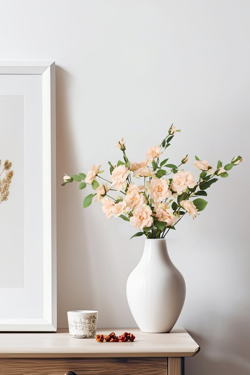 The artificial Iceberg rose flower has small flowers, and when it is placed in a white vase, it reflects its beauty even more. You can place it as a home decoration on your table.