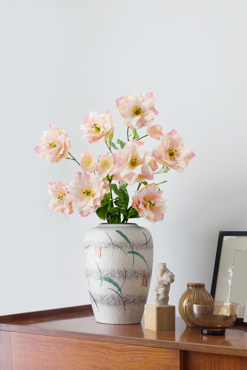 Mauve-pink Clematis blossoms bring vibrant elegance to any space, showcased in a lifelike arrangement within a vase.