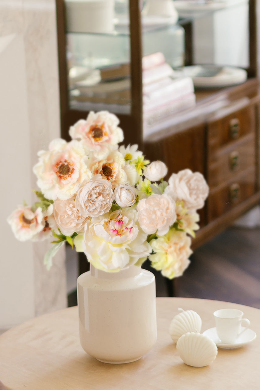 Pink-colored faux floral arrangements always seem to put people in a happy mood and it makes a great home centerpiece.