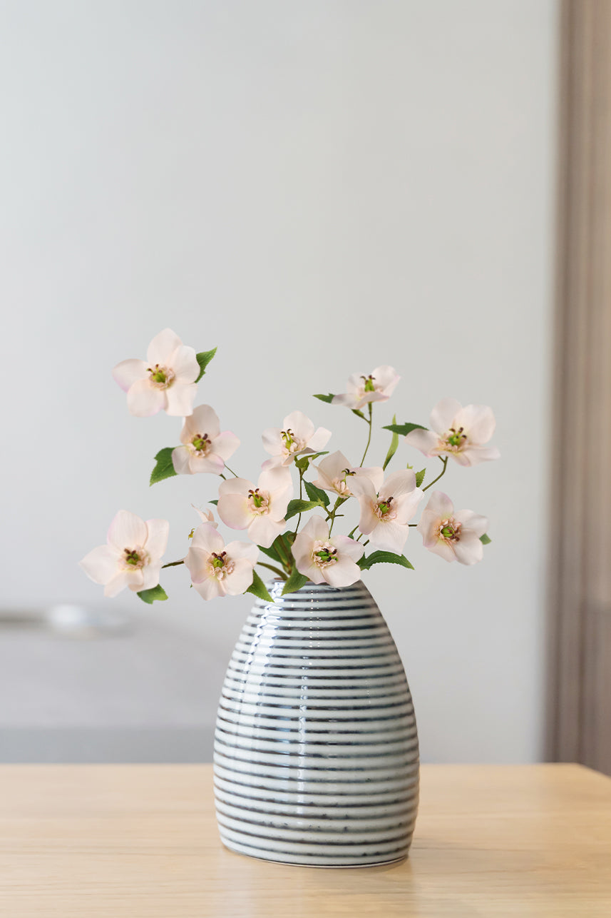 The peach pink artificial helleborus is perfect for flower arrangements and becomes a work of art when it is placed in a vase.