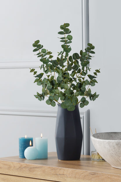 This stunning arrangement combines the grace of the spiral eucalyptus foliage with the clean and sophisticated charm of a black vessel.