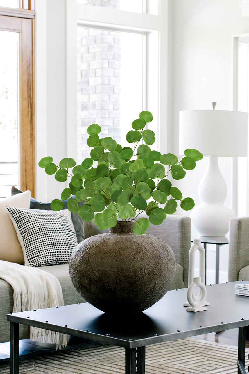 Artificial silver dollar eucalyptus leaves often give a vibrant look, making this faux leaf a suitable home decoration.