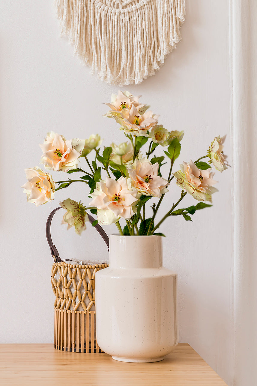 The unique texture on the artificial clematis petals sets it apart from other flowers, try placing it in a white vase.