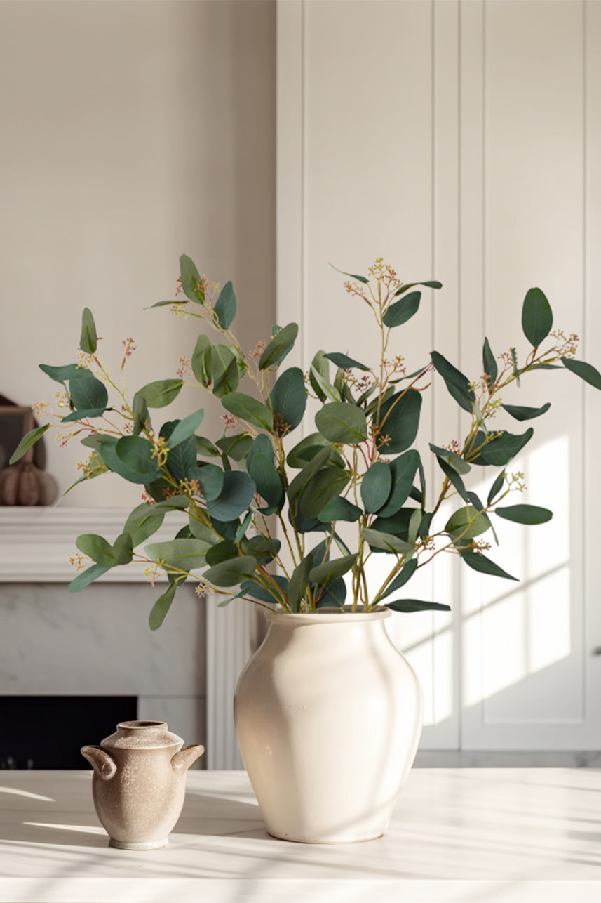 A warm and comfortable scene with green branches and leaves adds a touch of nature to the home decor.