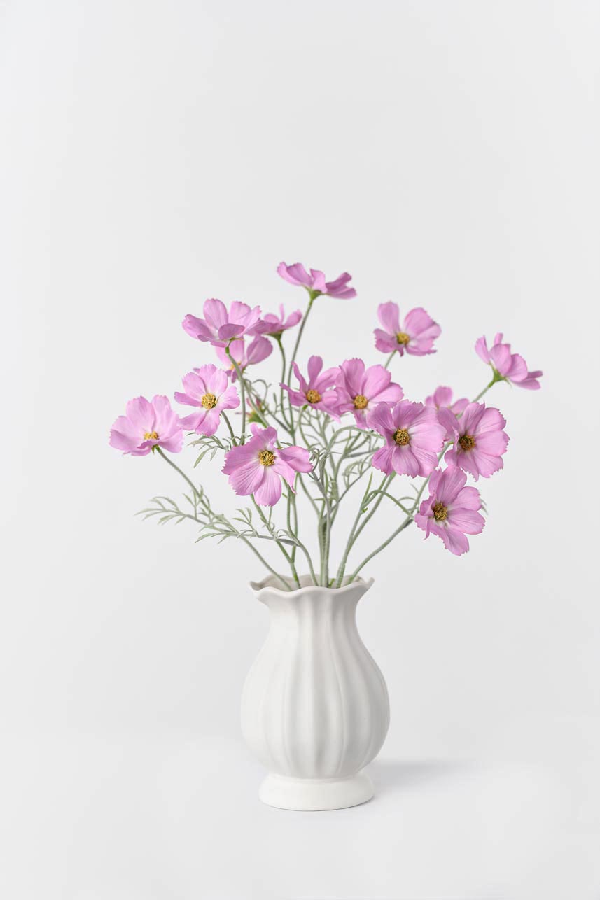 Artificial lavender pink cosmos flowers with 24-inch stems displayed in a vase filled with silk flowers