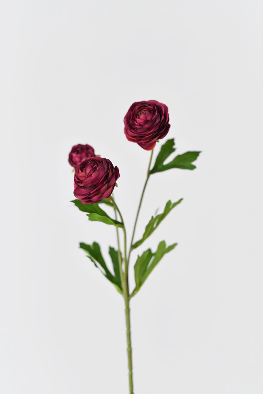 Artificial silk Ranunculus flowers arranged in a silk floral arrangement, in red color