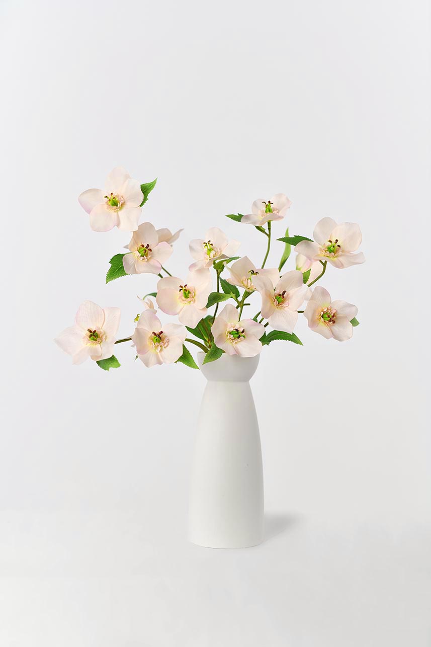 Artificial real-looking Helleborus flowers, gorgeous arrangements in a white vase, adding natural charm to any space.