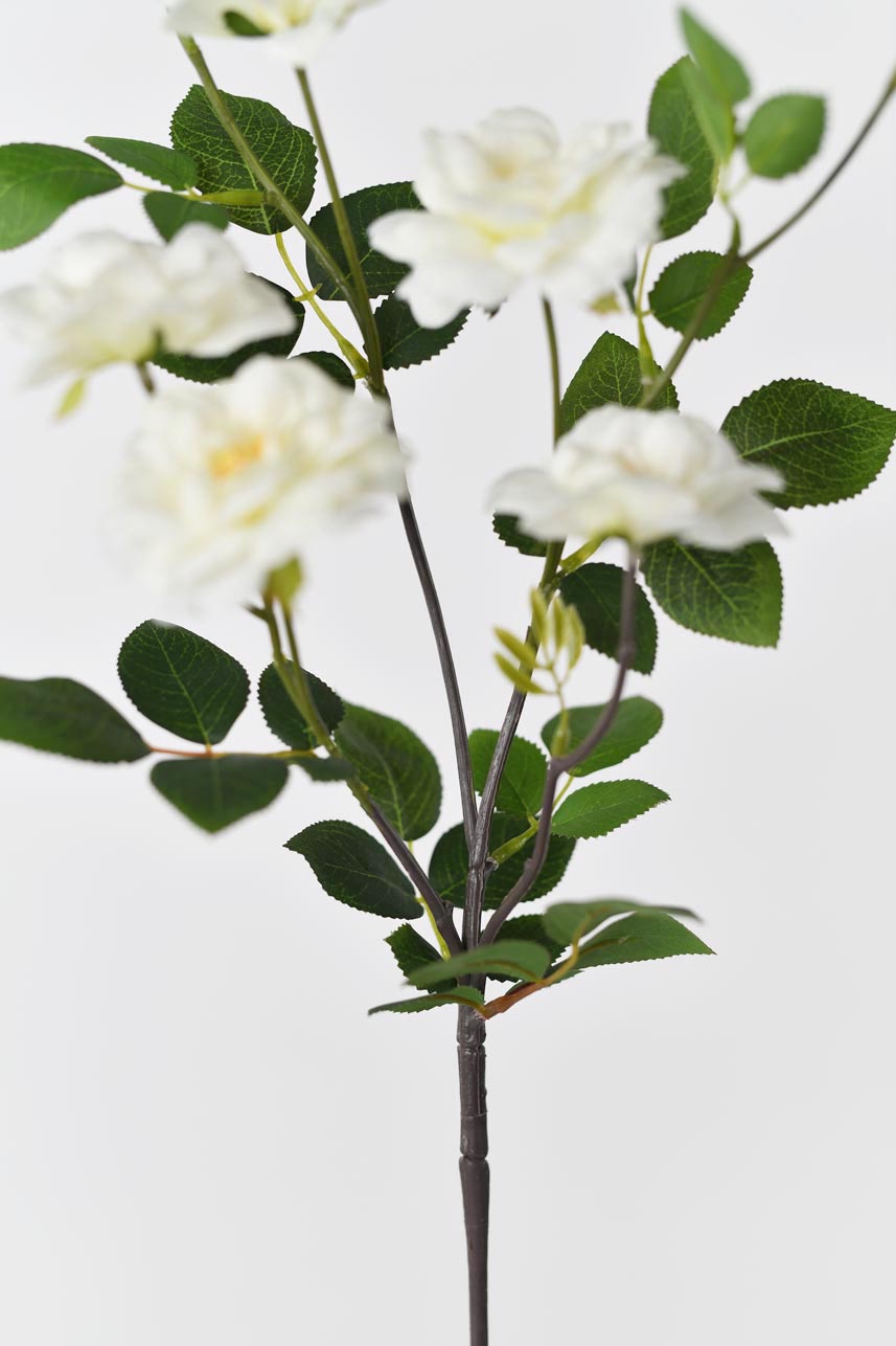 A close-up detail of Iceberg Rose silk flowers with a textured medley of foliage, adding a chic touch to your home style home.