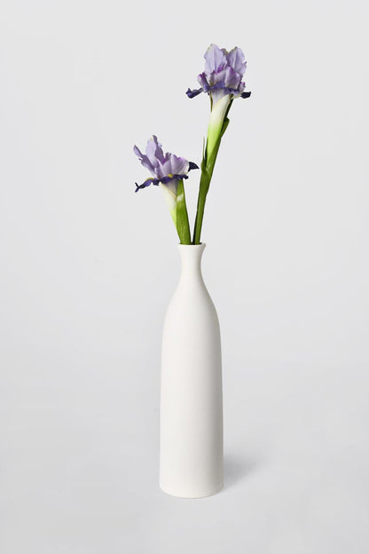 Pretty and life-like purple Iris fake flowers arrangements in a white vase, fancy a fresh from the garden feel.