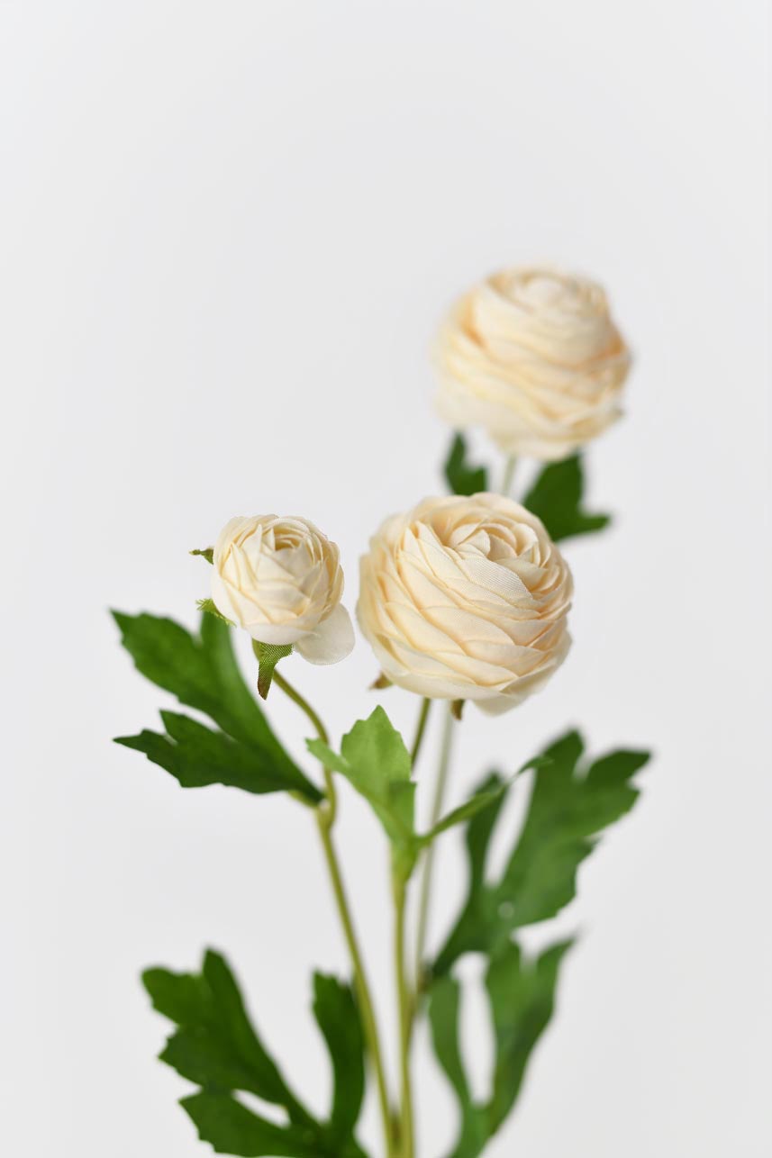Faux silk flowers in yellow peach with bright green leaves and realistic petals textures
