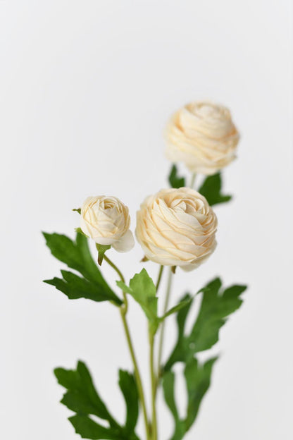 Faux silk flowers in yellow peach with bright green leaves and realistic petals textures