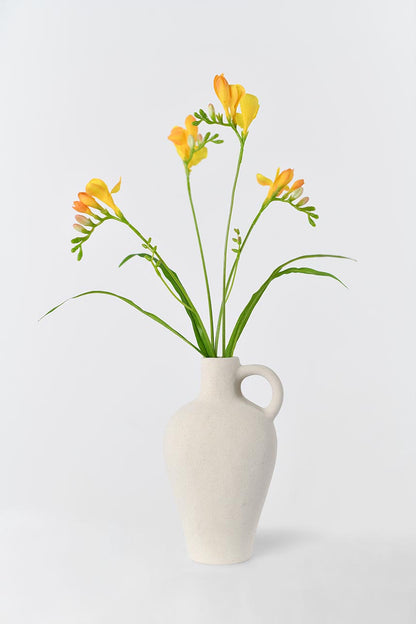 A great addition to any home with this beautiful and lifelike faux freesia flower in orange color. Its faux stem makes it look natural and realistic.