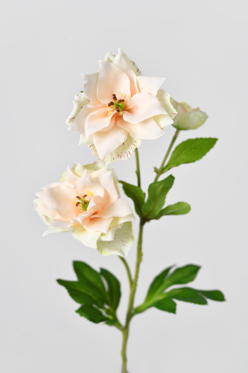 Plastic stamens are wrapped in layers of faux petals, a total of three blooms, artificial flowers with slender stems and full color foliage.
